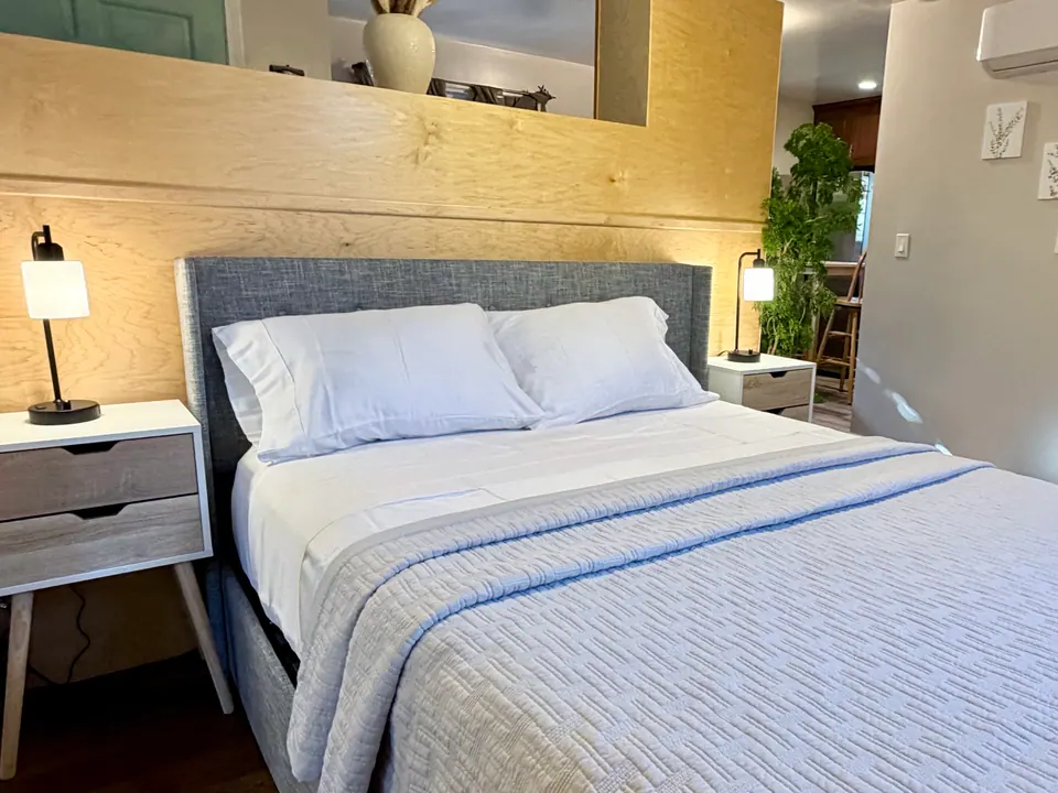 Queen bed with crisp white linens