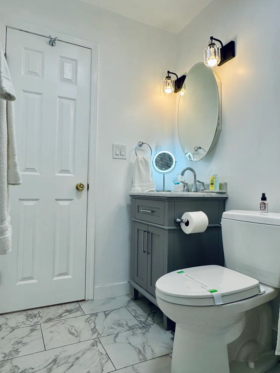 Vanity with lighted makeup mirror